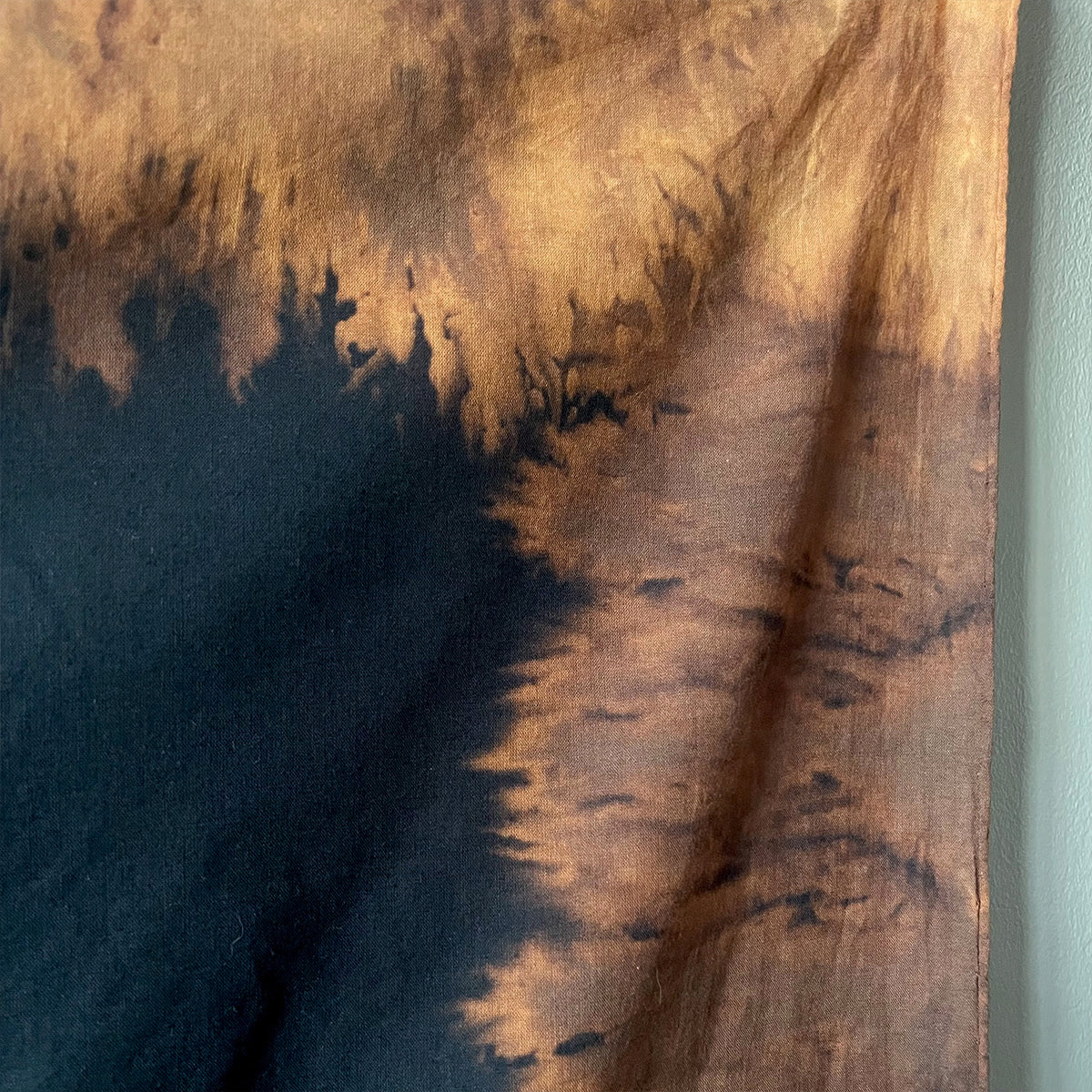 Close-up of a fabric surface with dyed colour and texture