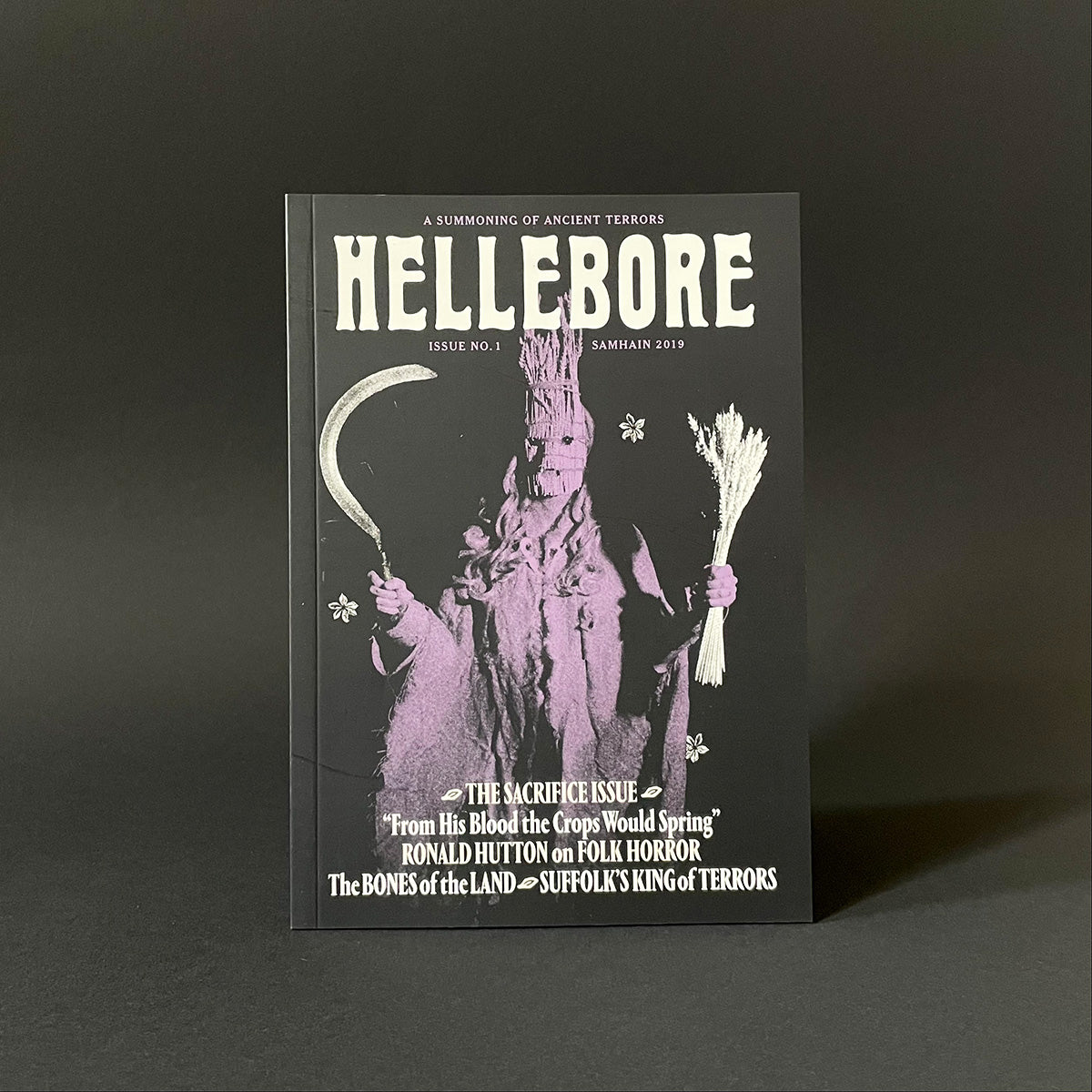 Magazine cover titled 'Hellebore' with a dark background