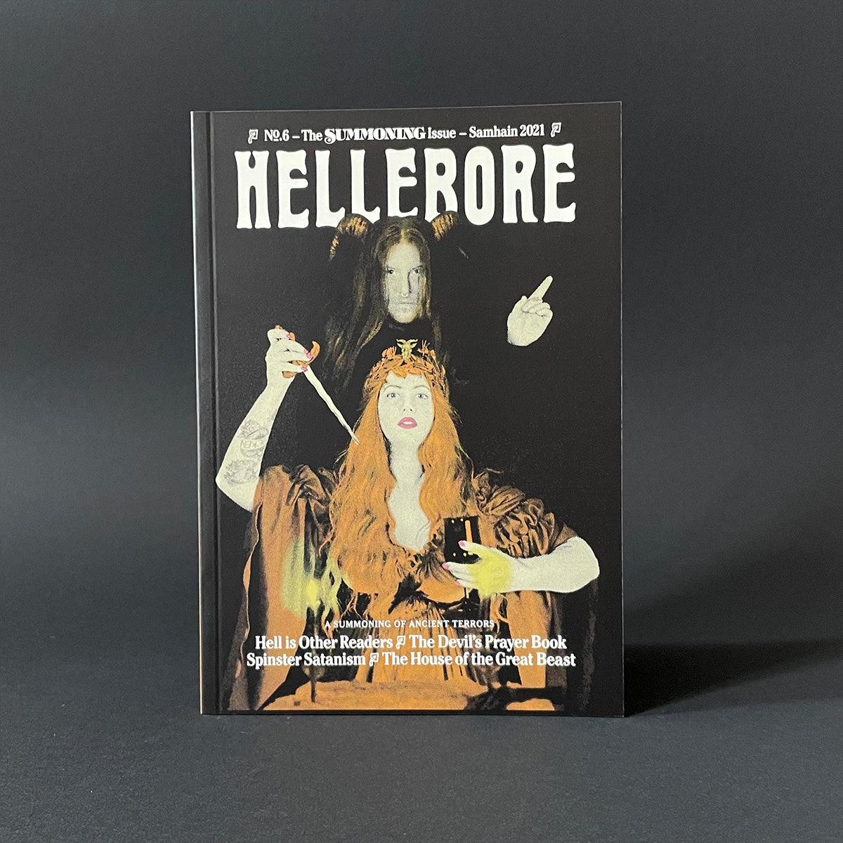 Magazine cover titled 'HELLERORE' with artistic illustration on a dark background