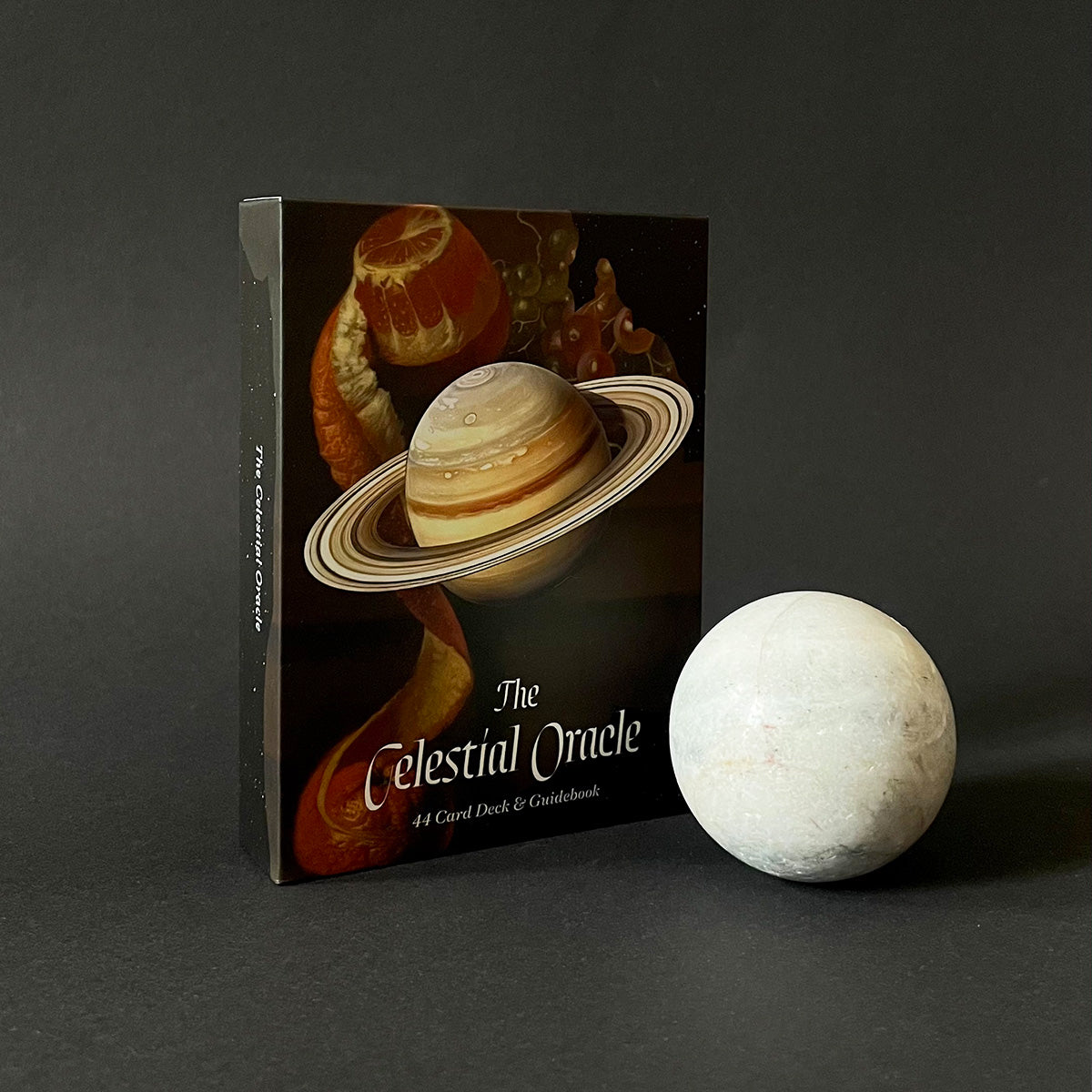Celestial Oracle card deck with a white sphere on a dark background