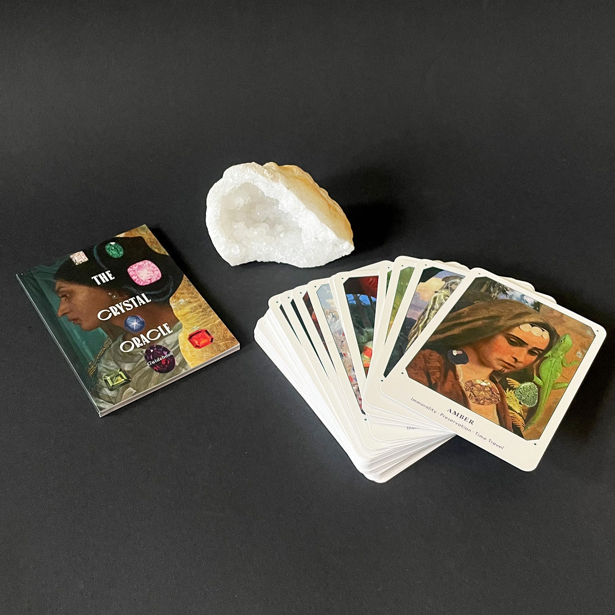 Set of oracle cards with a crystal on a dark surface