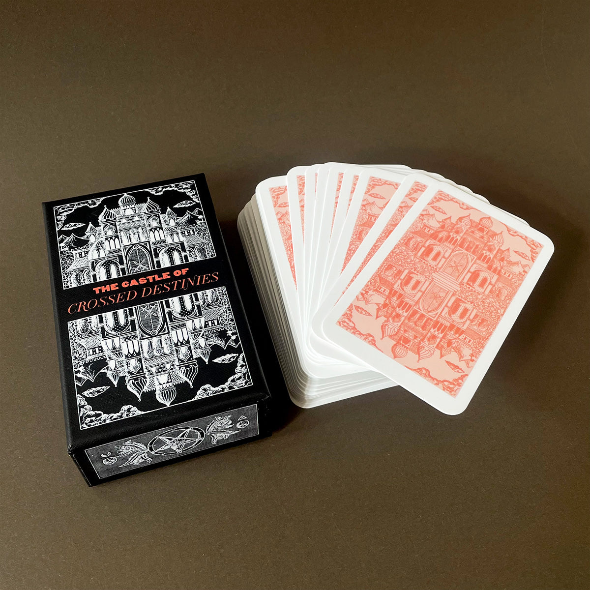 Collection of tarot cards and a box on a dark background