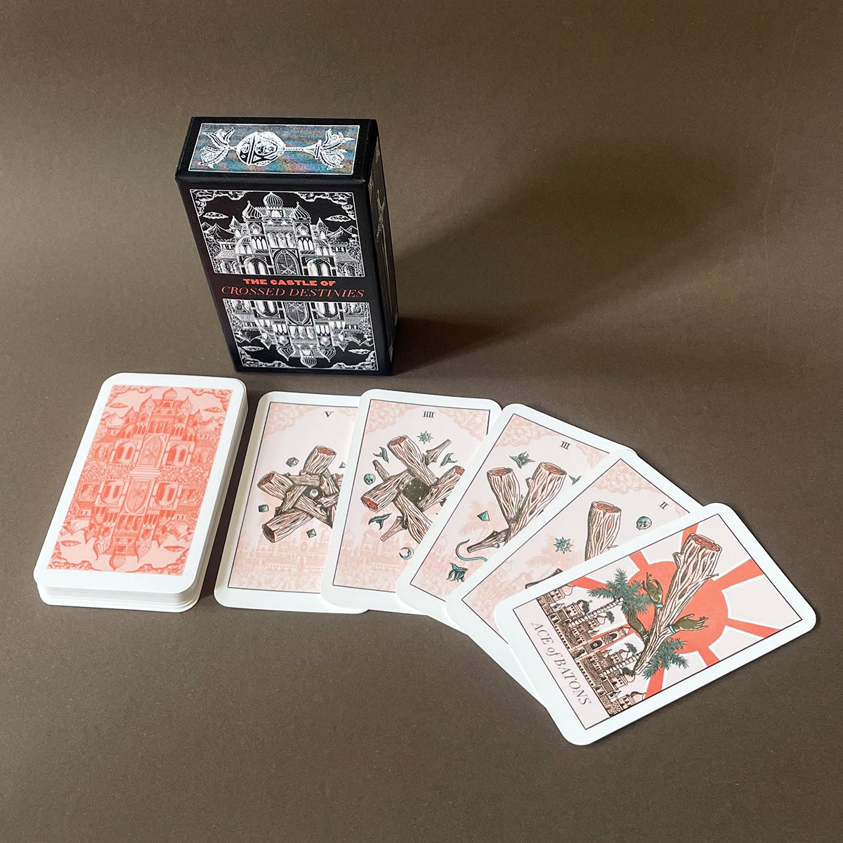 Collection of tarot cards and a box on a dark background