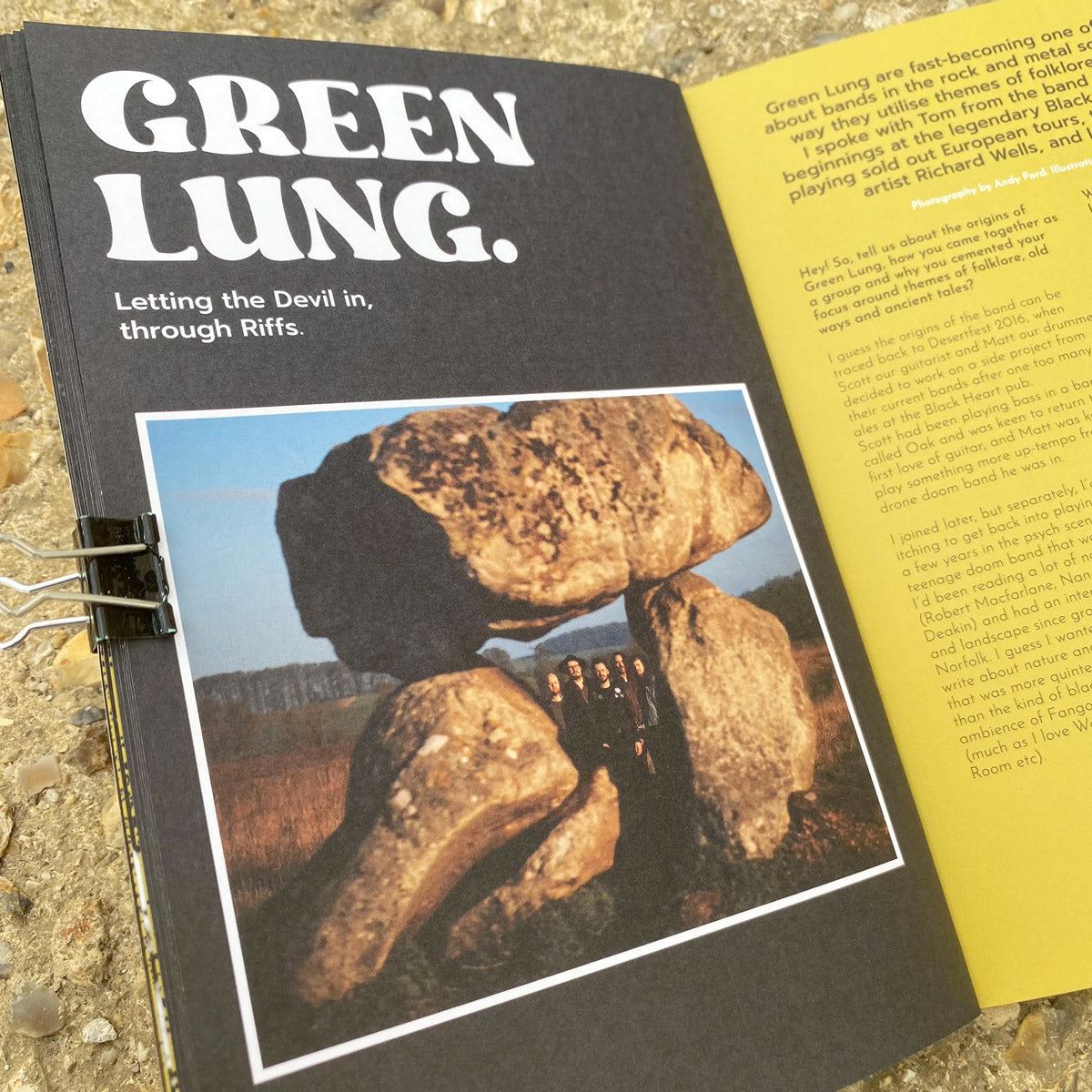 Magazine with article titled 'Green Lung' with an image featuring rocks and text on a textured surface.