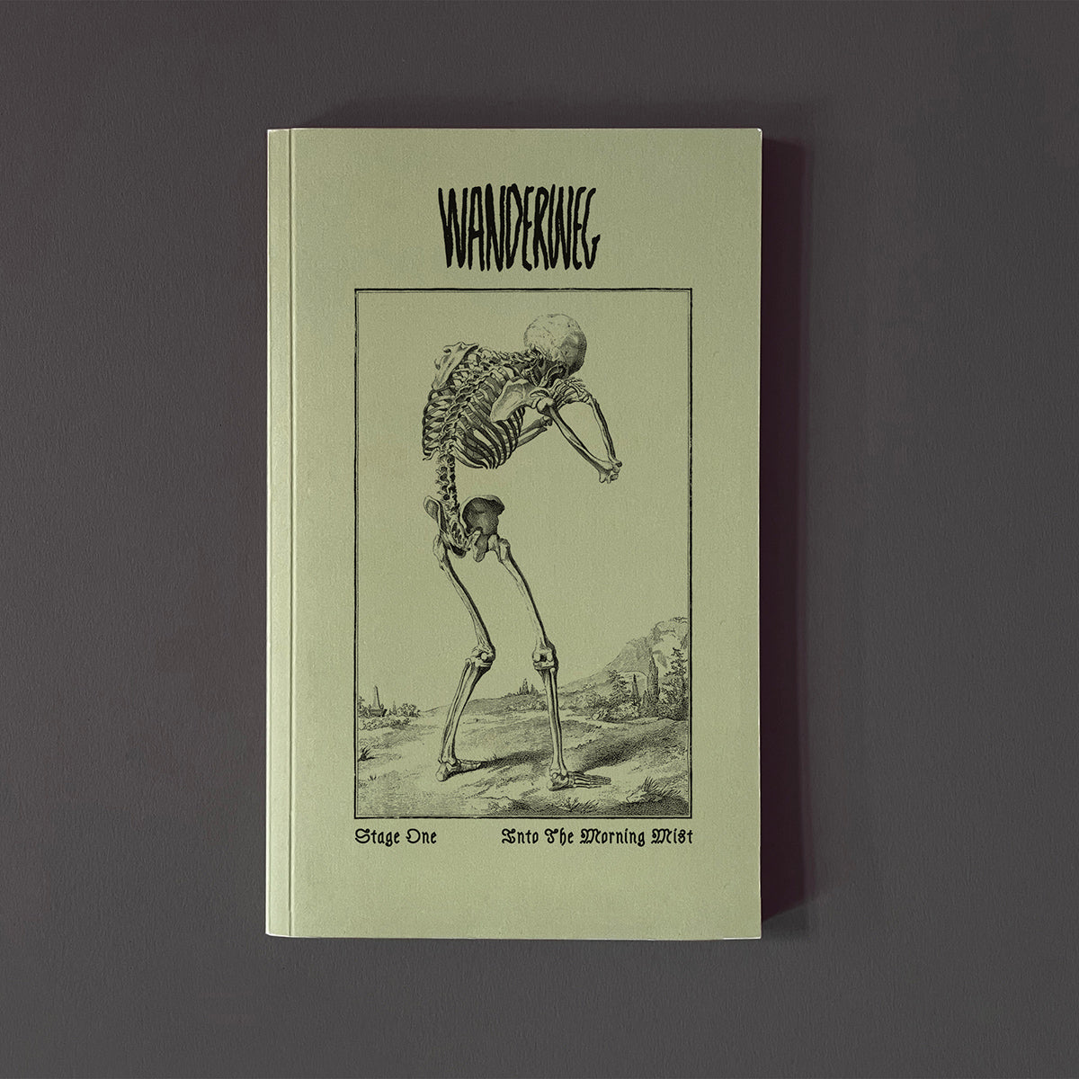 Magazine titled 'Wanderweg' with a skeleton illustration on a dark background