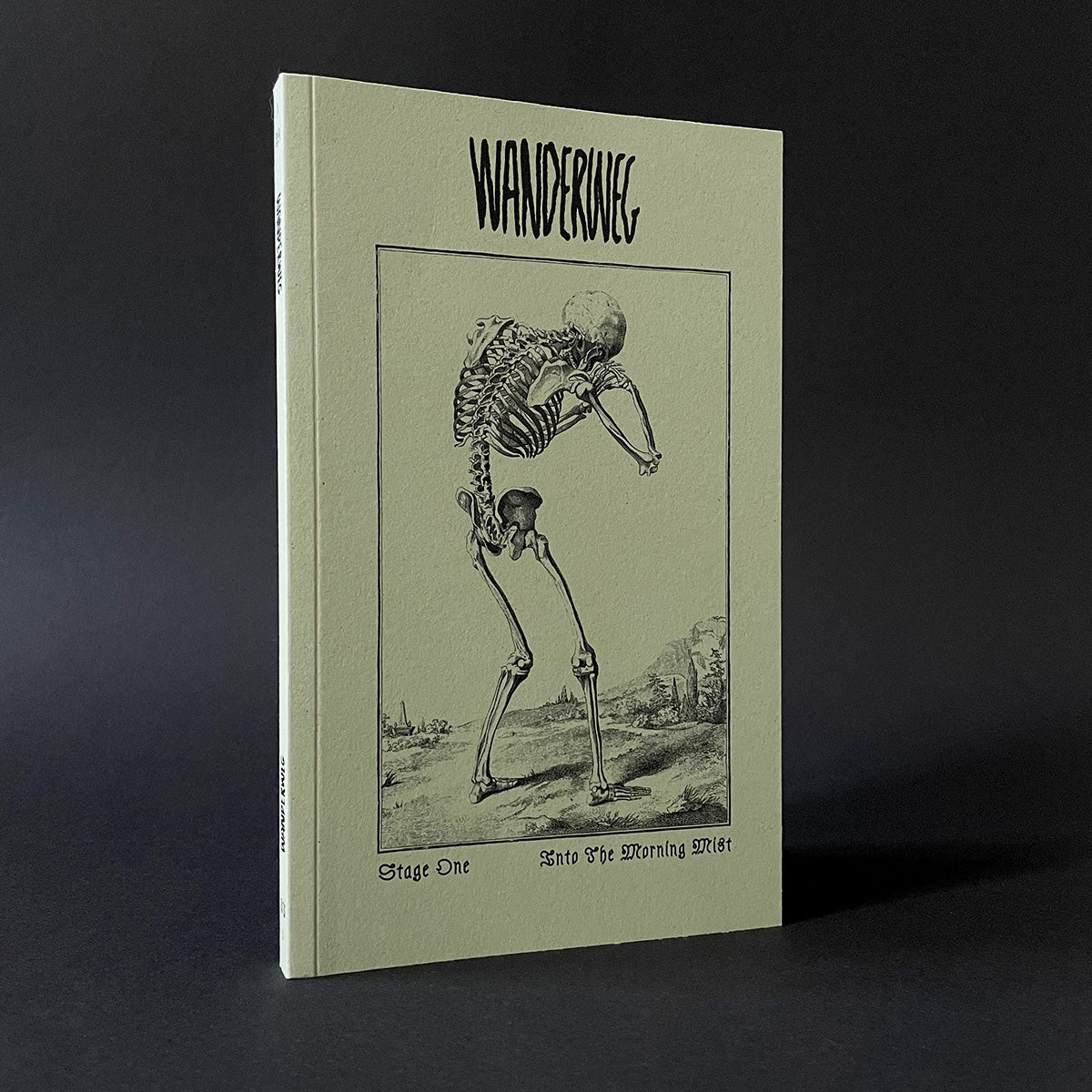 Magazine titled 'Wanderweg' with a skeleton illustration on a dark background